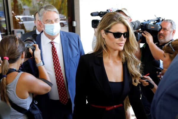 Lindsey Halligan standing near Donald Trump at a public event.