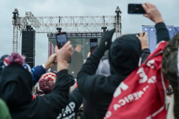 Former President Donald Trump speaking at a political rally regarding midterm elections.