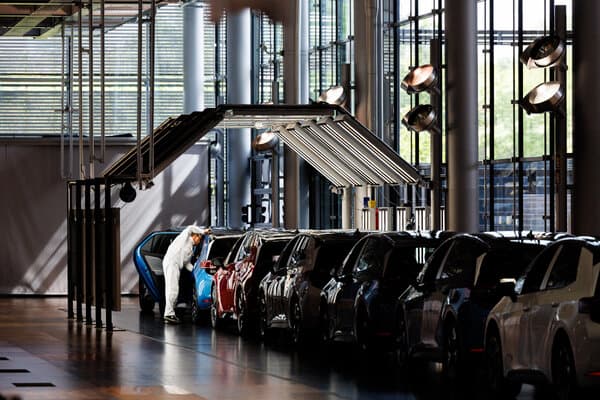 A Volkswagen vehicle on a showroom floor or factory line illustrating the company's current market challenges.