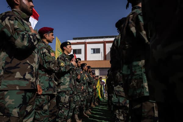 Lebanese army officials surveying a cache of weapons turned in by militant groups